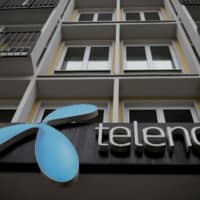 Telenor\'s logo is seen in central Belgrade last year. | REUTERS