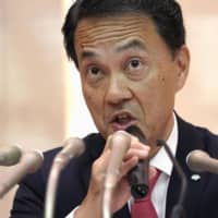 Nomura Holdings Inc. Deputy President Kentaro Okuda speaks to the media in Tokyo on Monday. He will be promoted to the financial services group\'s CEO effective April 1. | KYODO