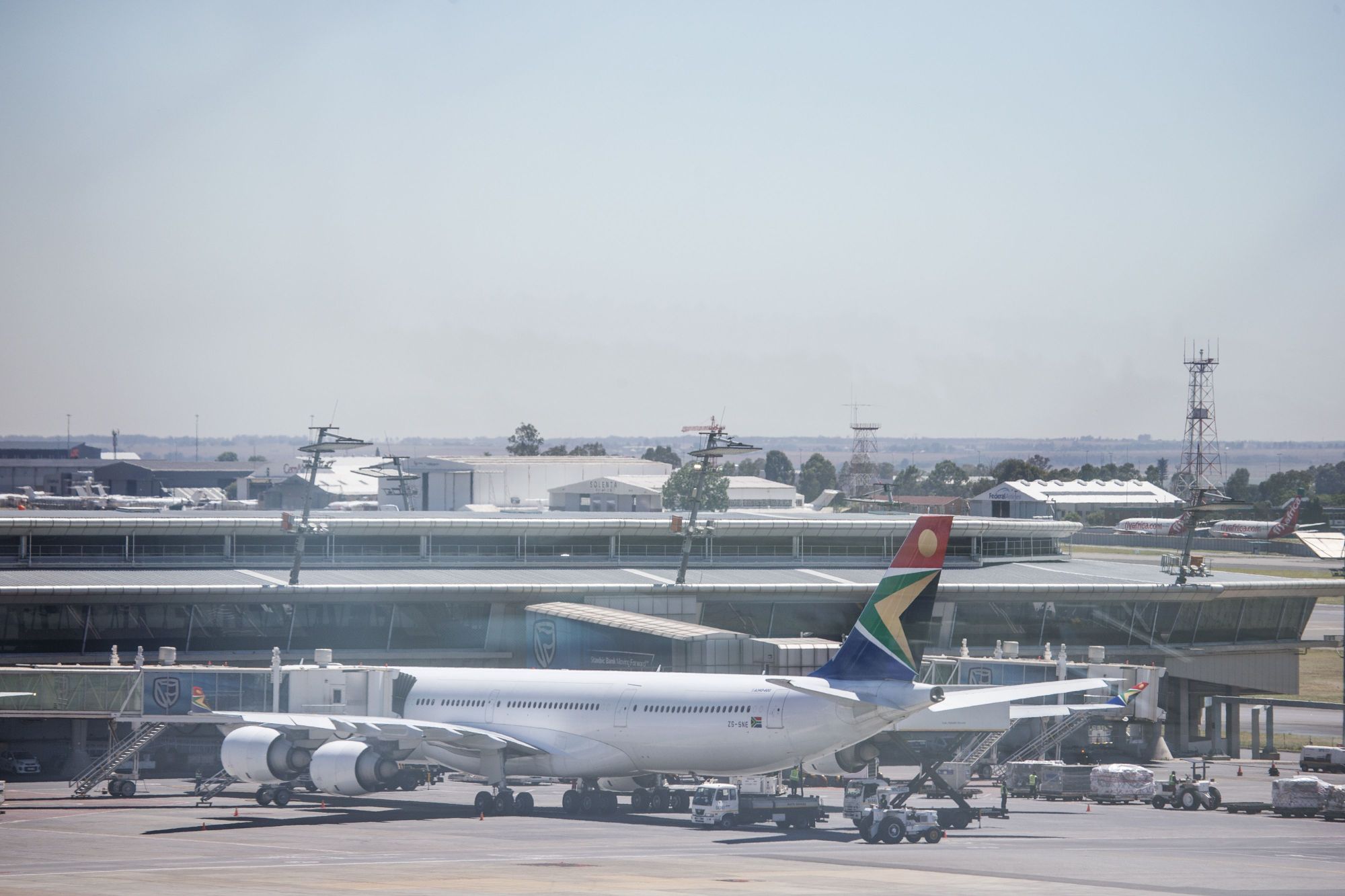 A South African Airways jetliiner is seen at the O.R. Tambo International Airport in Johannesburg Nov. 15. SAA was placed under a state-approved rescue plan Thursday as part of a restructuring process after a week-long strike was held last month. | AFP-JIJI