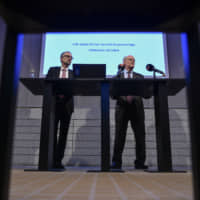 Jesper Hansson (left), head of the Monetary Policy Department of the Sveriges Riksbank, pauses as Stefan Ingves, governor of the Sveriges Riksbank, speaks during a news conference at the Swedish central bank headquarters in Stockholm on Thursday. | BLOOMBERG