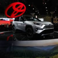 A Toyota Motor Corp. RAV4 XSE hybrid vehicle is displayed during AutoMobility LA ahead of the Los Angeles Auto Show on Nov. 28, 2018. | BLOOMBERG