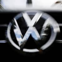 The VW logo is seen at the site of the first hearing of a consumer group\'s class action suit on behalf of Volkswagen owners against VW over the diesel emissions cheating scandal, at the Higher Regional Court in Braunschweig, Germany, in September. | REUTERS