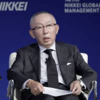 Tadashi Yanai, chairman and chief executive officer of Fast Retailing Co., speaks at the 21st Nikkei Global Management Forum in Tokyo in October. | BLOOMBERG
