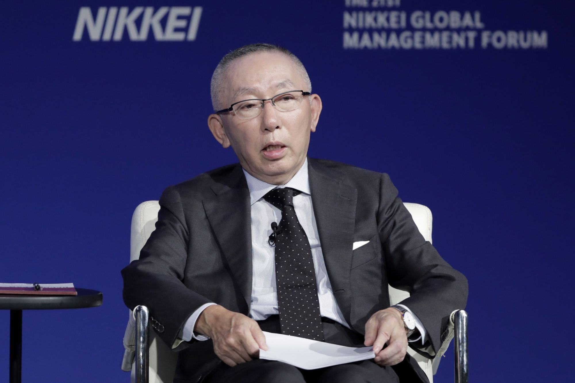 Tadashi Yanai, chairman and chief executive officer of Fast Retailing Co., speaks at the 21st Nikkei Global Management Forum in Tokyo in October. | BLOOMBERG