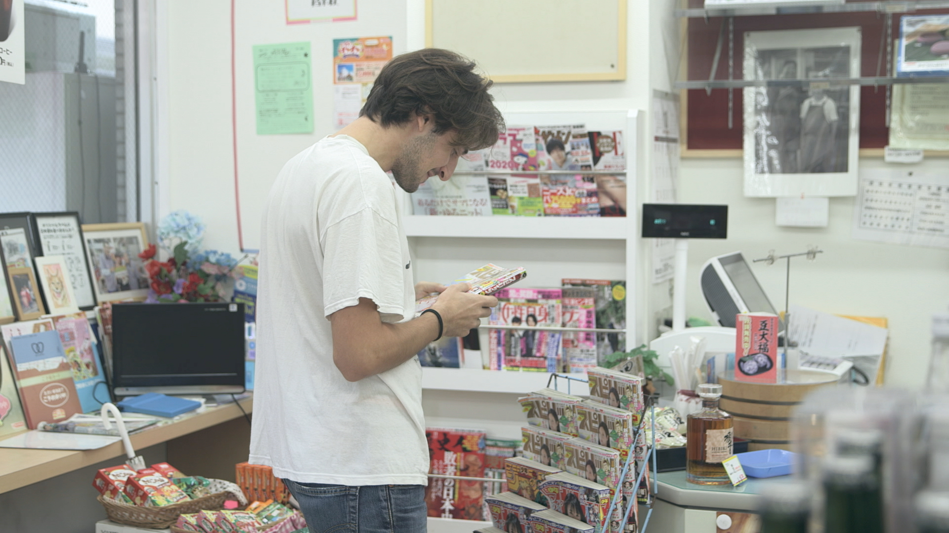 Point of pride: Peppe checks out his newly published manga on 'Terrace House Tokyo 2019-2020.' | © FUJI TELEVISION / EAST ENTERTAINMENT