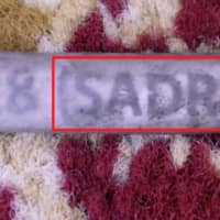 The name of a company believed by U.S. government authorities to be associated with Iran, SADRA, is seen on a wiring harness label from the wreckage of the Sept. 14 attack on an Aramco oil facility in Saudi Arabia in this handout image provided by a U.S. government source. | U.S. GOVERNMENT / HANDOUT / VIA REUTERS