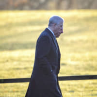 Britain\'s Prince Andrew (foreground) and Prince Charles arrive to attend a church service at St. Mary Magdalene Church in Sandringham, Norfolk, England, Wednesday. | JOE GIDDENS / PA WIRE( / PA / VIA AP