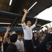 Future Forward leader Thanathorn Juangroongruangkit talks to his supporters during rally in Bangkok on Saturday. | AP