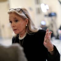 U.S. Rep. Debbie Dingell speaks to a reporter about President Donald Trump\'s comments made at a Michigan campaign rally about Dingell and her late husband, former Democratic Rep. John Dingell, at the U.S. Capitol in Washington Thursday. | REUTERS