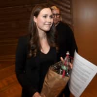 Sanna Marin, a candidate for Finnish prime minister, is seen after the Social Democratic Party\'s vote on the country\'s leader in Helsinki on Sunday. | REUTERS