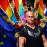 A reveller takes part in the annual Gay Pride parade, also called Christopher Street Day parade, in Berlin on July 22, 2017. | REUTERS