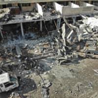 An aerial view shows the destruction following a regime airstrike on Monday on a market in the town of Maaret al-Numan in the jihadi-run Syrian province of Idlib. Regime airstrikes killed 15 civilians in Syria\'s last major opposition bastion, where deadly clashes between regime forces and armed groups have escalated in the past two days, the Britain-based Syrian Observatory for Human Rights said. | AFP-JIJI