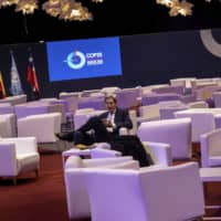 John Kerry, the former U.S. Secretary of State under the Barack Obama administration, sits during the COP25 summit in Madrid Thursday. Kerry praised young activists who he said are \"committed to hold adults accountable\" on the issue of climate change, and criticized what he called Donald Trump\'s \"unpresidential\" mockery of one of the movement\'s most prominent figures, Swedish teen Greta Thunberg. | AP