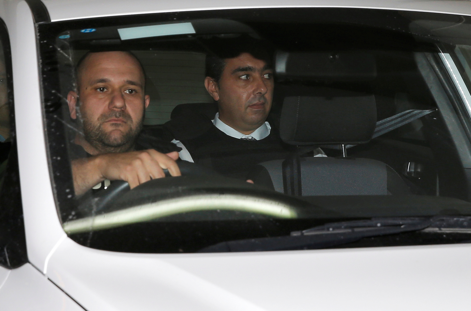 Melvin Theuma, who allegedly acted as a middle man in a plot to murder of journalist Daphne Caruana Galizia, is seen in a police car as he leaves the Courts of Justice in Valletta Wednesday. | REUTERS