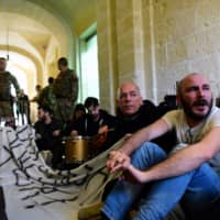Activists continue to protest Monday after barging into the building of Prime Minister Joseph Muscat\'s office in Valletta, Malta, demanding his resignation in the wake of developments over the 2017 murder of anti-corruption journalist Daphne Caruana Galizia. | REUTERS
