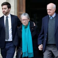 The son of Daphne Caruana Galizia, Andrew Caruana Galizia, and her parents, Rose Vella and Michael Vella, leave the Courts of Justice after a hearing of Melvin Theuma, who allegedly acted as a middle man in a plot to murder the journalist, in Valletta Wednesday. | REUTERS