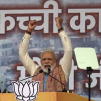 Indian Prime Minister Narendra Modi addresses a rally of his Hindu nationalist Bharatiya Janata Party in New Delhi on Sunday. | AP