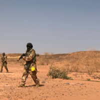 Nigerien commandos simulate a raid on a militant camp during the U.S. sponsored Flintlock exercises in Ouallam, Niger, last year. | REUTERS