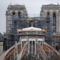 Repair work continues Monday on Notre Dame Cathedral to stabilise the cathedral\'s structure nine months after a fire caused significant damage, in Paris. | REUTERS