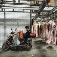 Criminal gangs in China have been faking outbreaks of swine fever on farms and forcing farmers to sell their healthy pigs at sharply lower prices. | BLOOMBERG
