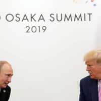 U.S. President Donald Trump meets with Russian President Vladimir Putin (left) at the G20 leaders summit in Osaka June 28. | REUTERS