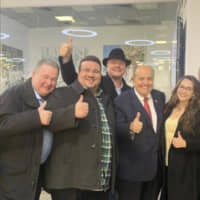 In this photo provided by the Twitter feed of Andrii Telizhenko, Rudy Giuliani, (second, right) personal lawyer to U.S President Donald Trump, stands with Andrii Telizhenko (second left) and other unidentified people prior to his departure from Ukraine in Kyiv Boryspil Airport Friday. Telizhenko says he met with Giuliani in Kyiv to discuss an anti-corruption project. | ANDRIII TELIZHENKO / VIA AP