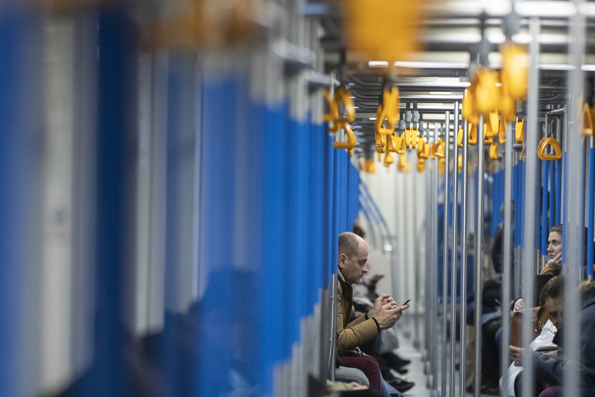 A man uses his smartphone in a subway train in Moscow Monday. Russia's Communications Ministry has scheduled an exercise for Monday that is intended to simulate what is being called the isolated operation of the internet. | AP