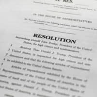 A copy of the Articles of Impeachment are seen Tuesday in Washington. House Democrats announced they are pushing ahead with two articles of impeachment against President Donald Trump &#8212; abuse of power and obstruction of Congress &#8212; charging he corrupted the U.S. election process and endangered national security in his dealings with Ukraine. | AP