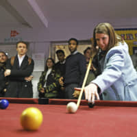 Liberal Democrats\' leader Jo Swinson poses for a photo during a visit to Knights Youth Centre in London while on the general election campaign trail in London Wednesday. Britain goes to the polls on Dec. 12. | AARON CHOWN / PA / VIA AP
