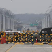 A military vehicle passes by the Unification Bridge, which leads to Panmunjom in the Demilitarized Zone in Paju, South Korea, Monday. U.S. Special Representative for North Korea Stephen Biegun said Monday that Washington won\'t accept a yearend deadline set by North Korea to make concessions in stalled nuclear talks and urged Pyongyang to return to a negotiating table immediately. | AP