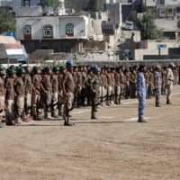 Newly recruited soldiers are pictured before a blast struck their parade in the town of al-Dhalea, Yemen, Sunday. | REUTERS