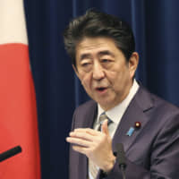 Prime Minister Shinzo Abe speaks during a news conference in Tokyo on Monday as the Diet session came to a close. | AP