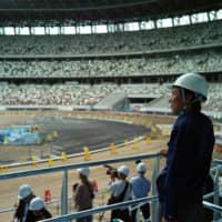 Construction demand, including for the new National Stadium, forms a large part of short-term Olympic economic benefits. | RYUSEI TAKAHASHI