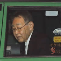 Former top bureaucrat Hideaki Kumazawa is released from Tokyo Detention House on Dec. 20. after he was found guilty of murdering his socially reclusive son in Tokyo earlier this year. | KYODO