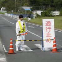 A road is closed near a pig farm in Chichibu, Saitama Prefecture, on Sept. 14 due to a hog cholera outbreak there. | KYODO