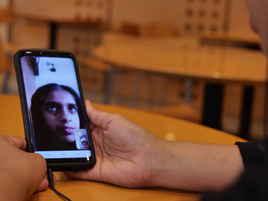 Sri Lankan national Dakshini Siriwardena, 21, talks on Skype with her younger sister, Pamalya, who left Japan after her father's business failure, on June 6. | CHISATO TANAKA