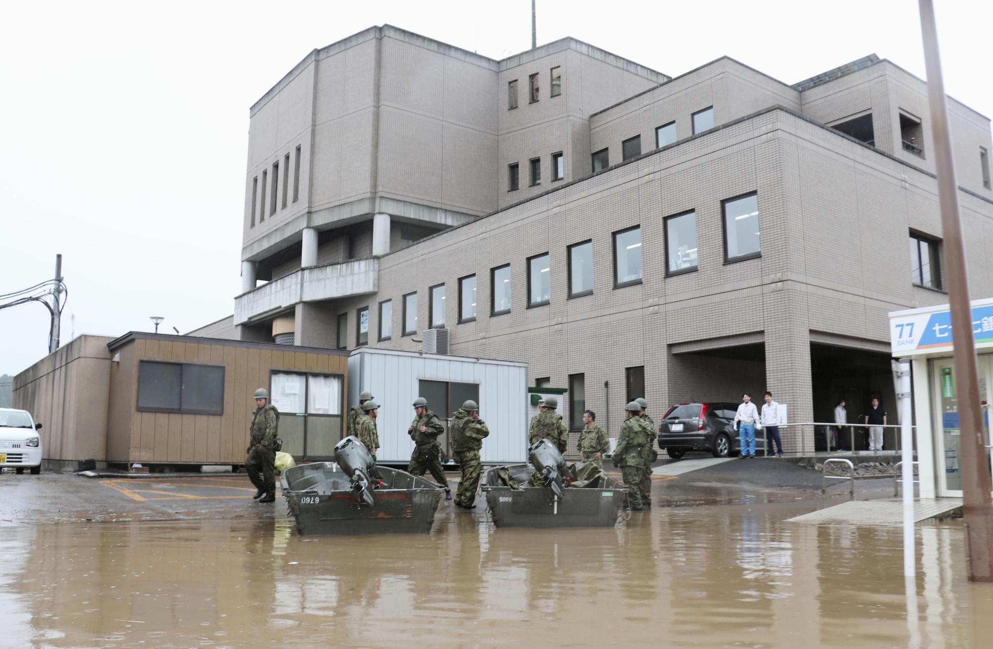The Marumori town office in Miyagi Prefecture is flooded after Typhoon Hagibis hit the region in October. | KYODO