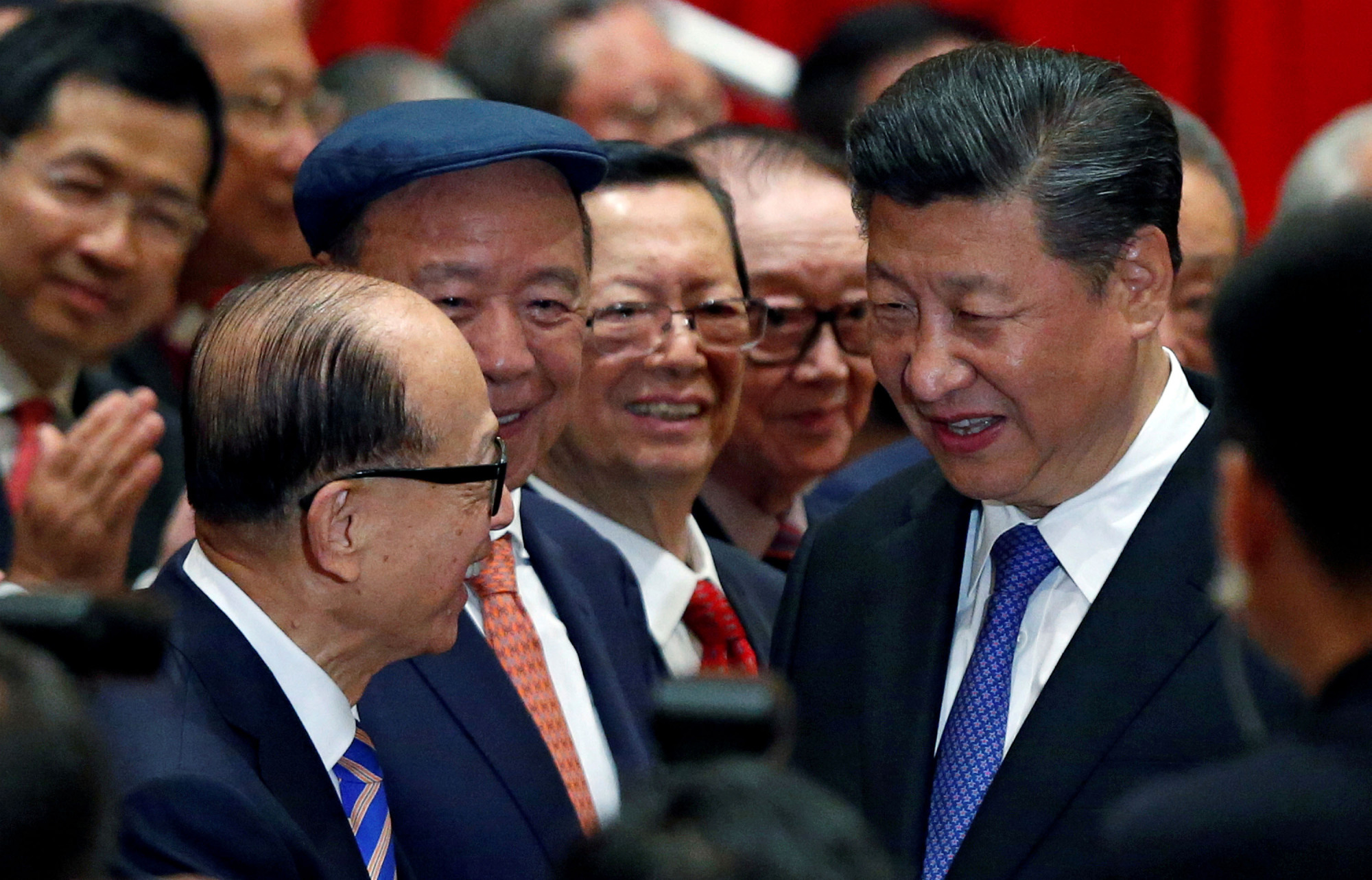 Chinese President Xi Jinping is greeted by tycoon Li Ka-shing before a photo session during Xi's visit to Hong Kong in June 2017. | REUTERS