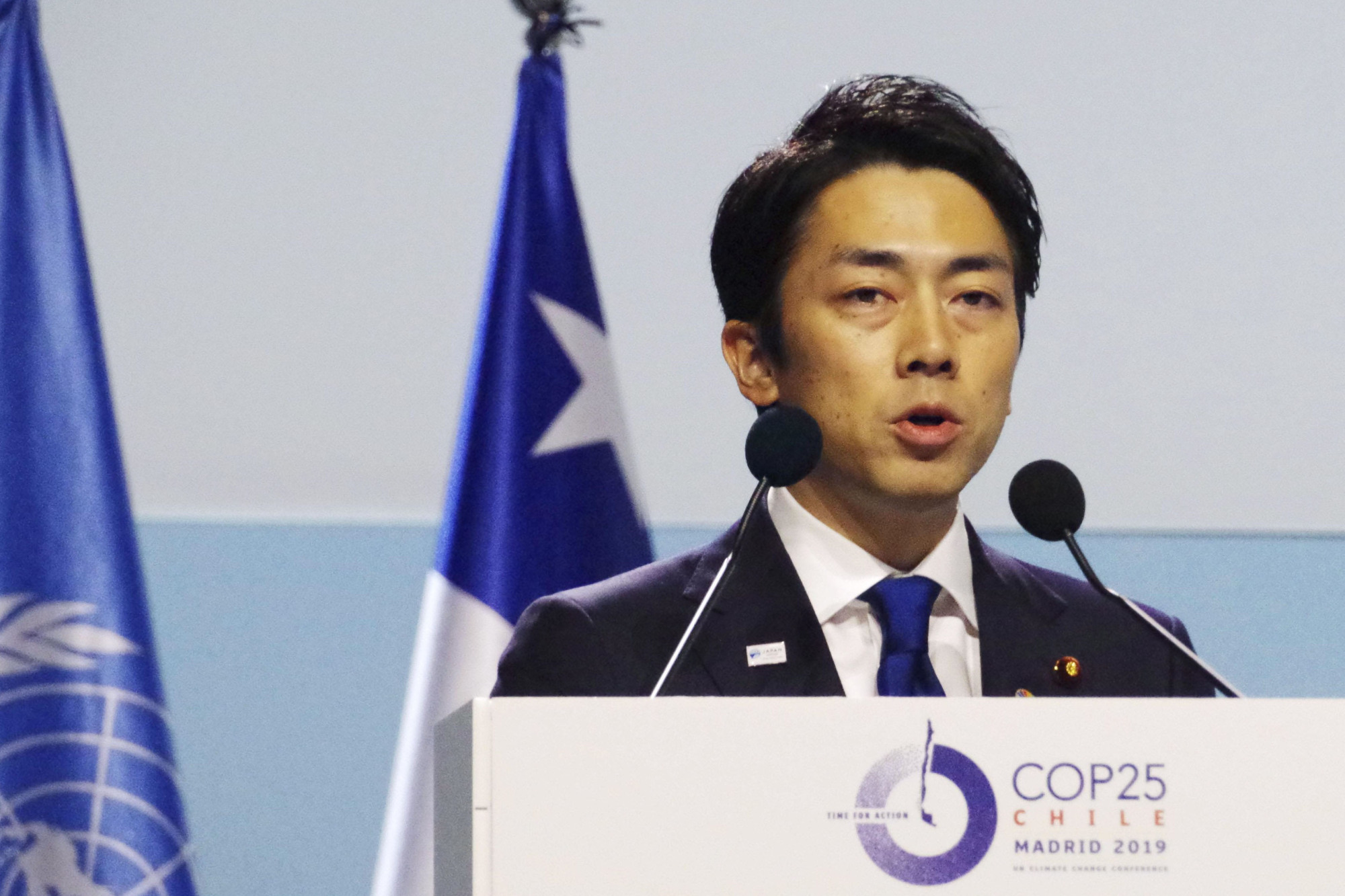 Environment Minister Shinjiro Koizumi makes a speech at a U.N. climate conference in Madrid on Wednesday. | KYODO