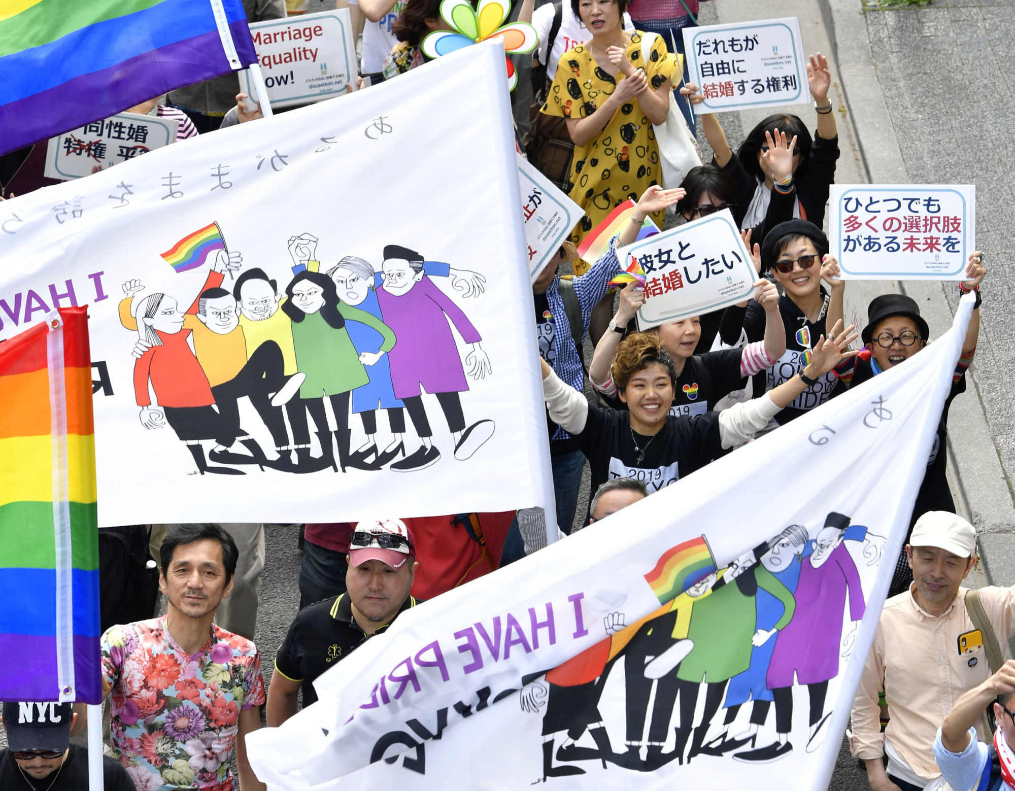 People march through the Shibuya district of Tokyo during the Tokyo Rainbow Pride 2019 parade in April. | KYODO