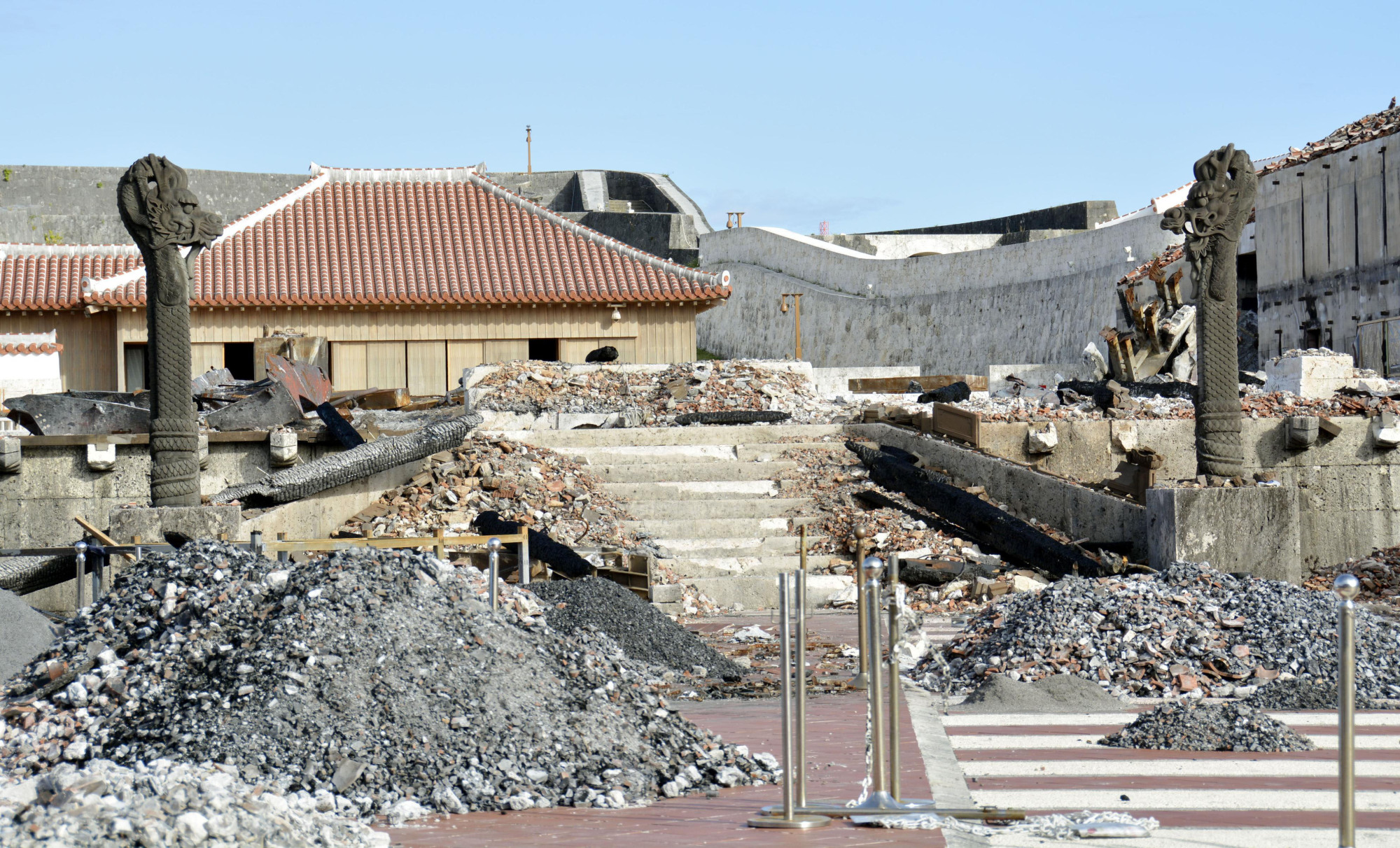 The burned-out remains of buildings at Shuri Castle, the main symbol of Okinawa Prefecture, are shown in Naha after a fire destroyed part of the UNESCO World Heritage site in October. | KYODO