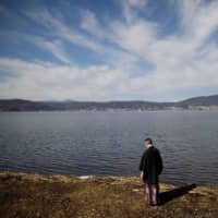 For nearly 600 years, priests at Yatsurugi Shrine, such as Kiyoshi Miyasaka (pictured), have observed ice cover on Lake Suwa in Nagano Prefecture, diligently recording it by hand, representing one of the world\'s oldest continuous measurements of climate change. | REUTERS