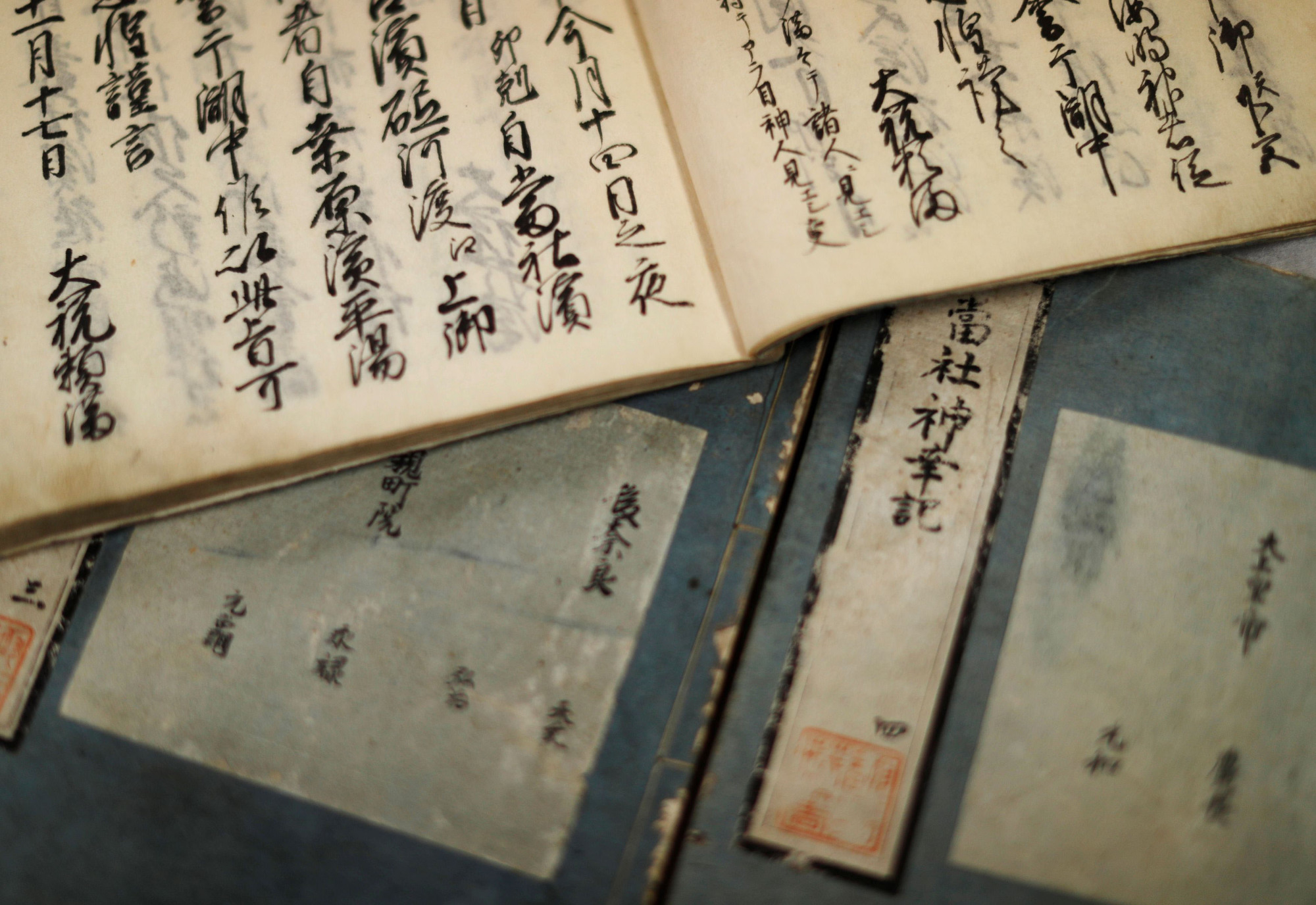 Record booklets containing observations of ice cover on Lake Suwa and major events in the towns surrounding the lake from 1443 to 1681 are displayed at the Suwa City Museum in Nagano Prefecture. | REUTERS