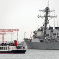 A U.S. Navy ship enters Yokosuka port in Kanagawa Prefecture in March 2018. | KYODO