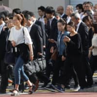 For decades workers have been clocking long hours, taking a fraction of their annual leave and remaining stuck in rigid work schedules. | BLOOMBERG