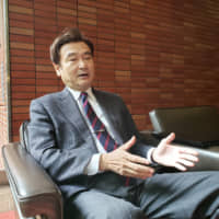 Masaru Tomita, director general of the Institute for Advanced Biosciences, Keio University, is interviewed at his home in Tokyo on Nov. 13. | TOMOHIRO OSAKI
