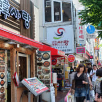 Nosing around: People shop in Shin-Okubo\'s Koreatown in the earlier half of the decade. The area attracted many Asian expats, some of whom sought out visiting K-pop acts like they were geisha in Kyoto. | SATOKO KAWASAKI
