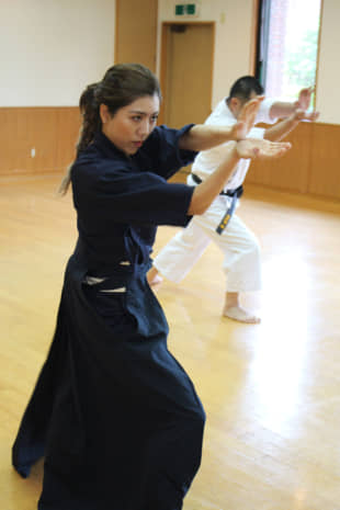 Aspiring actress Alice Iwamoto practices a kobudo martial art movement. | KYODO