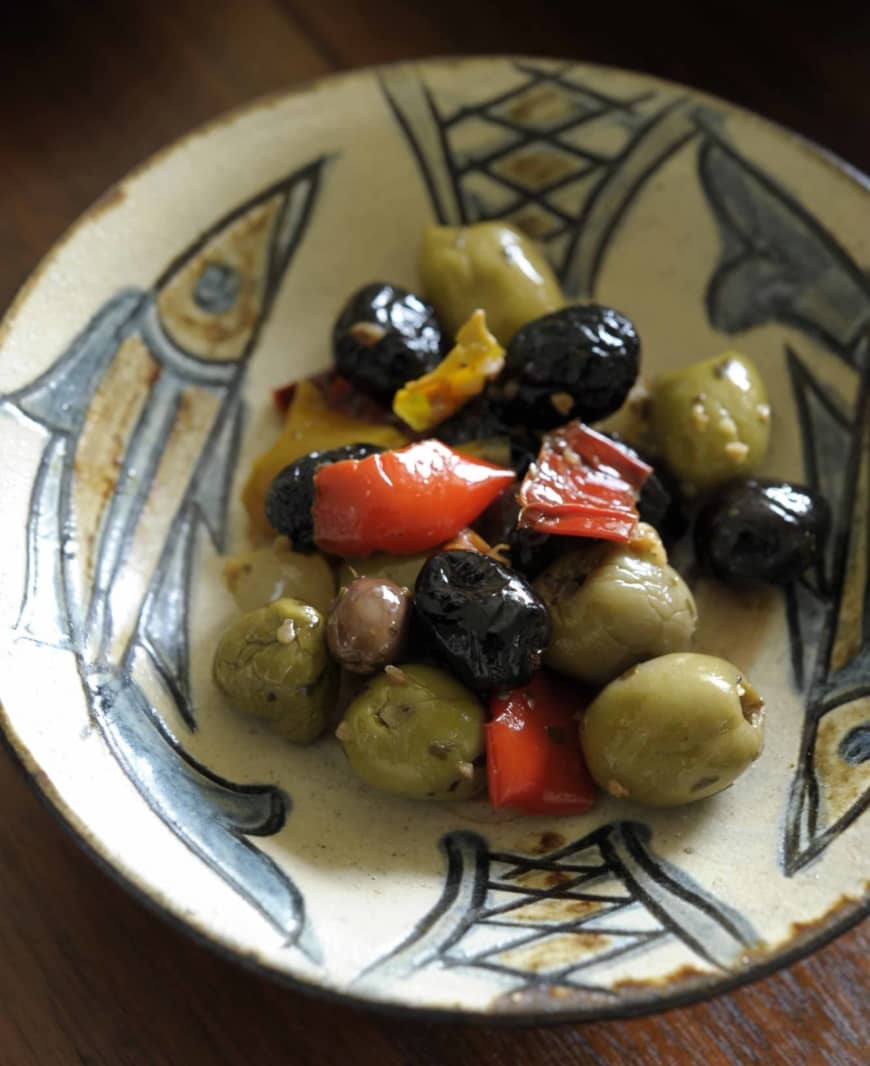 Olives and fishes: Olives from nearby Italy are served on a fish-pattern dish made by Jiro Kinjo (1912-2004), who was a National Living Treasure from Okinawa. | HIROSHI ABE