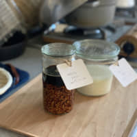 A very Japanese ingredient: A jar of neatly labeled shoyu kōji (a mixture of soy sauce and rice that has been inoculated with the mold Aspergillus oryzae) and shio kōji (salt kōji) ready for use in soups, marinades or dressings. | MOMOKO NAKAMURA